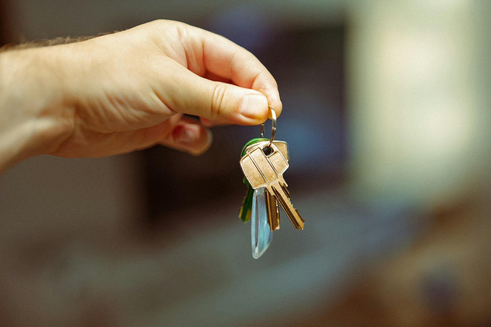 Hand holding a set of door keys